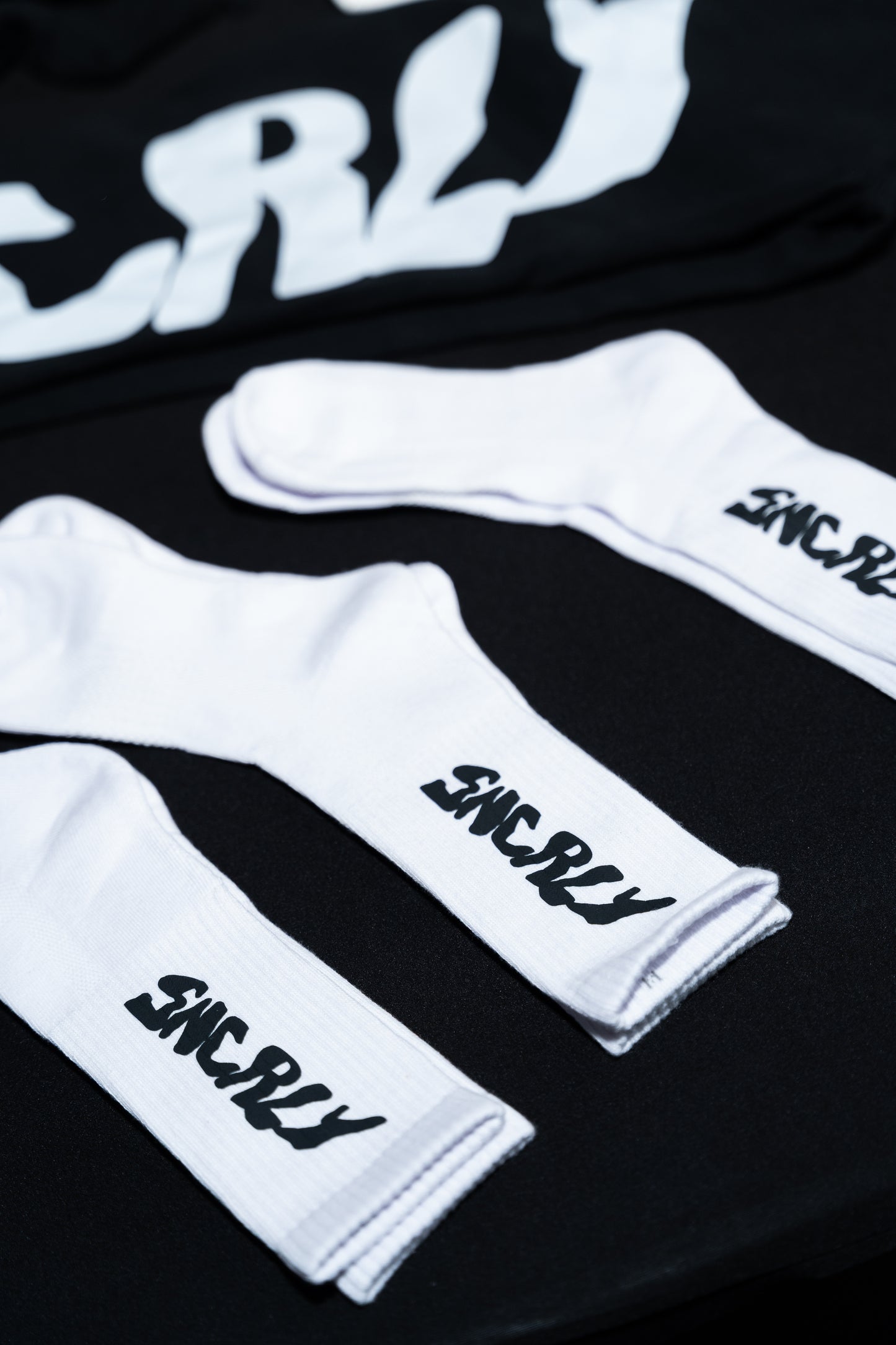 “Sncrly” socks